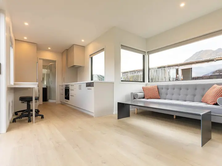 Timber-floored living room with mountain view, Central Otago